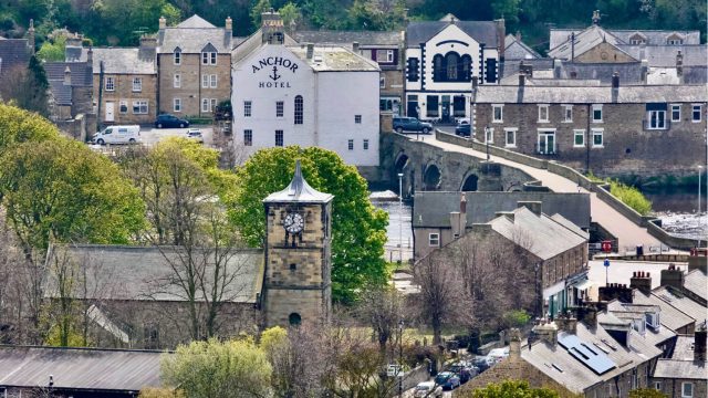 Looking down on a village with church, bridge and hotel