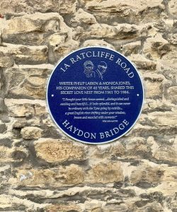 Blue plaque on a wall