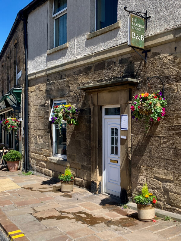building front with hanging baskets
