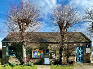 Stone building with two trees