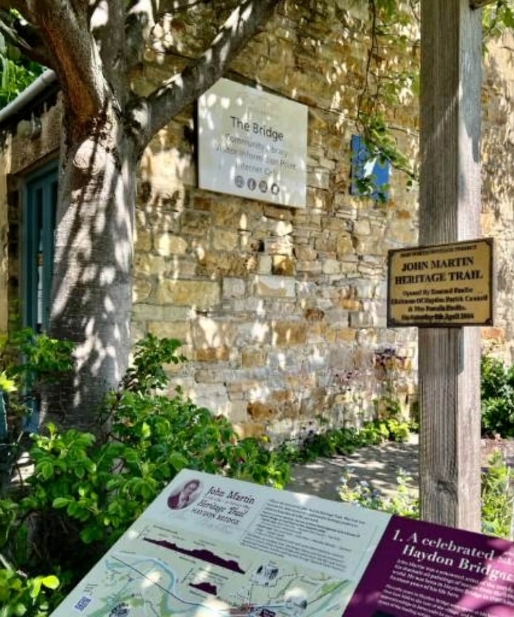A signpost in a shady corner