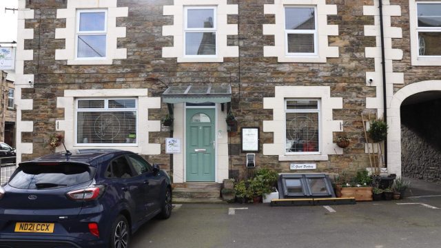 House with parked car