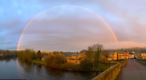 A rainbow over a village