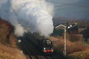 A steam locomotive and train